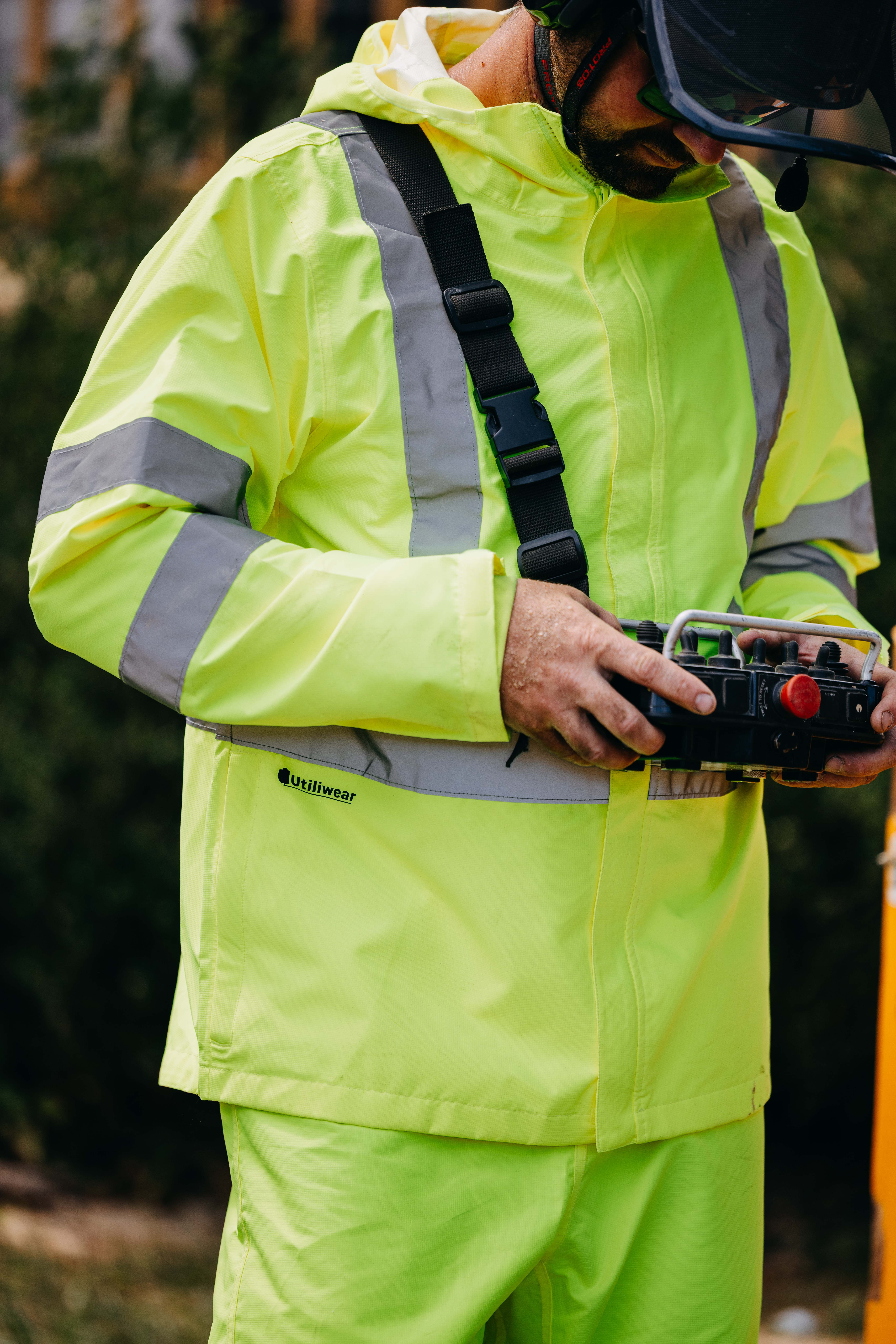 Utiliwear hi-vis rain jacket worn on the job